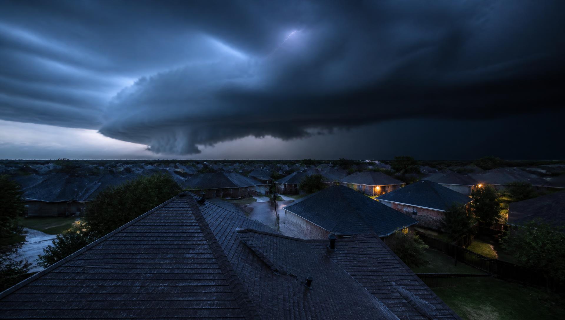 Supercell hail storm rolling over an American suburb at dusk